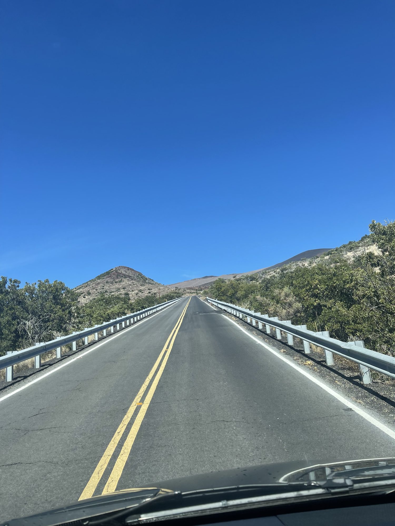 Driver's view of the Queen Kaahumanu Highway crossing the Kohala lava fields