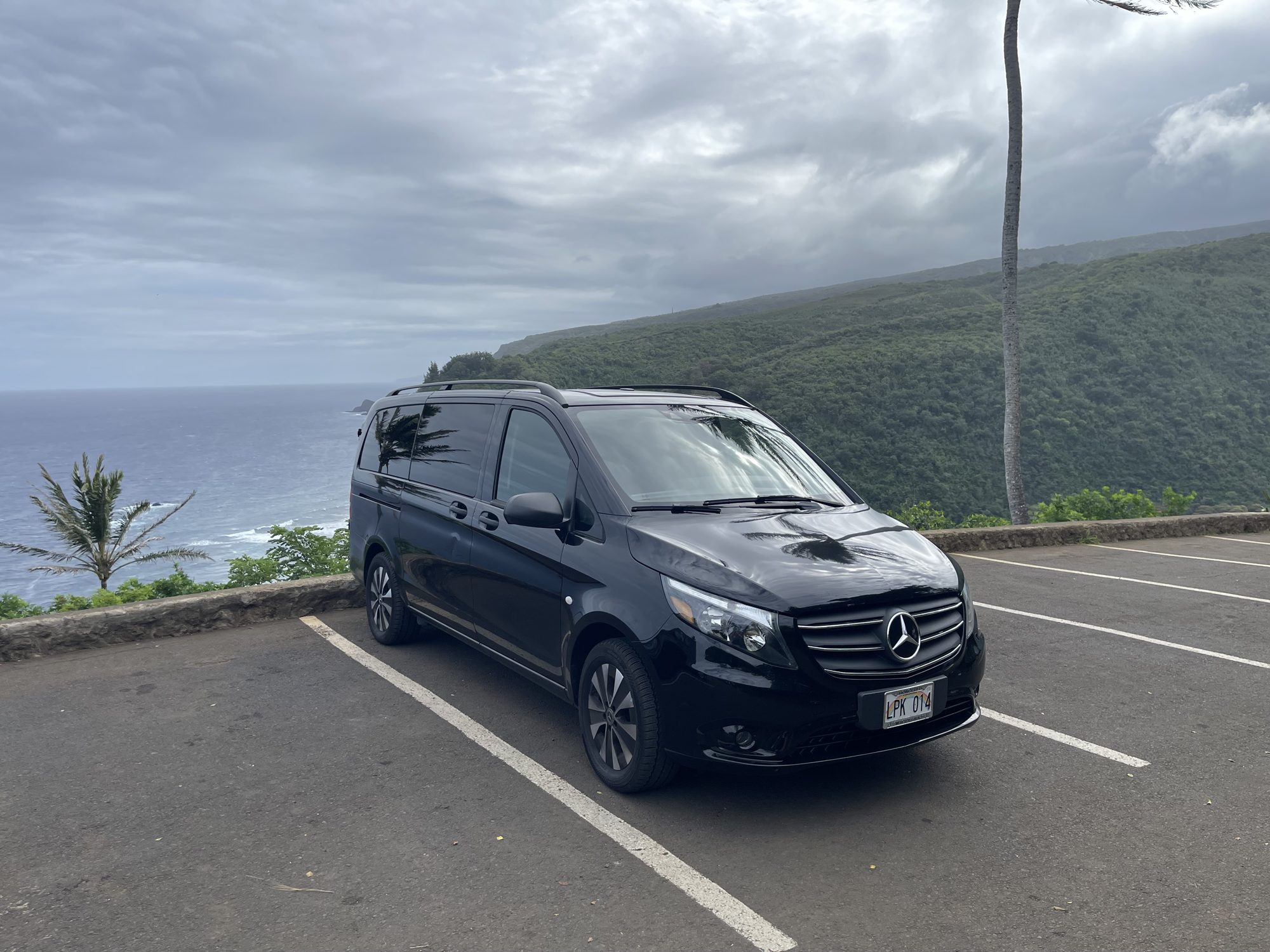 Black Mercedes-Benz Metris on the North Kohala coast highway